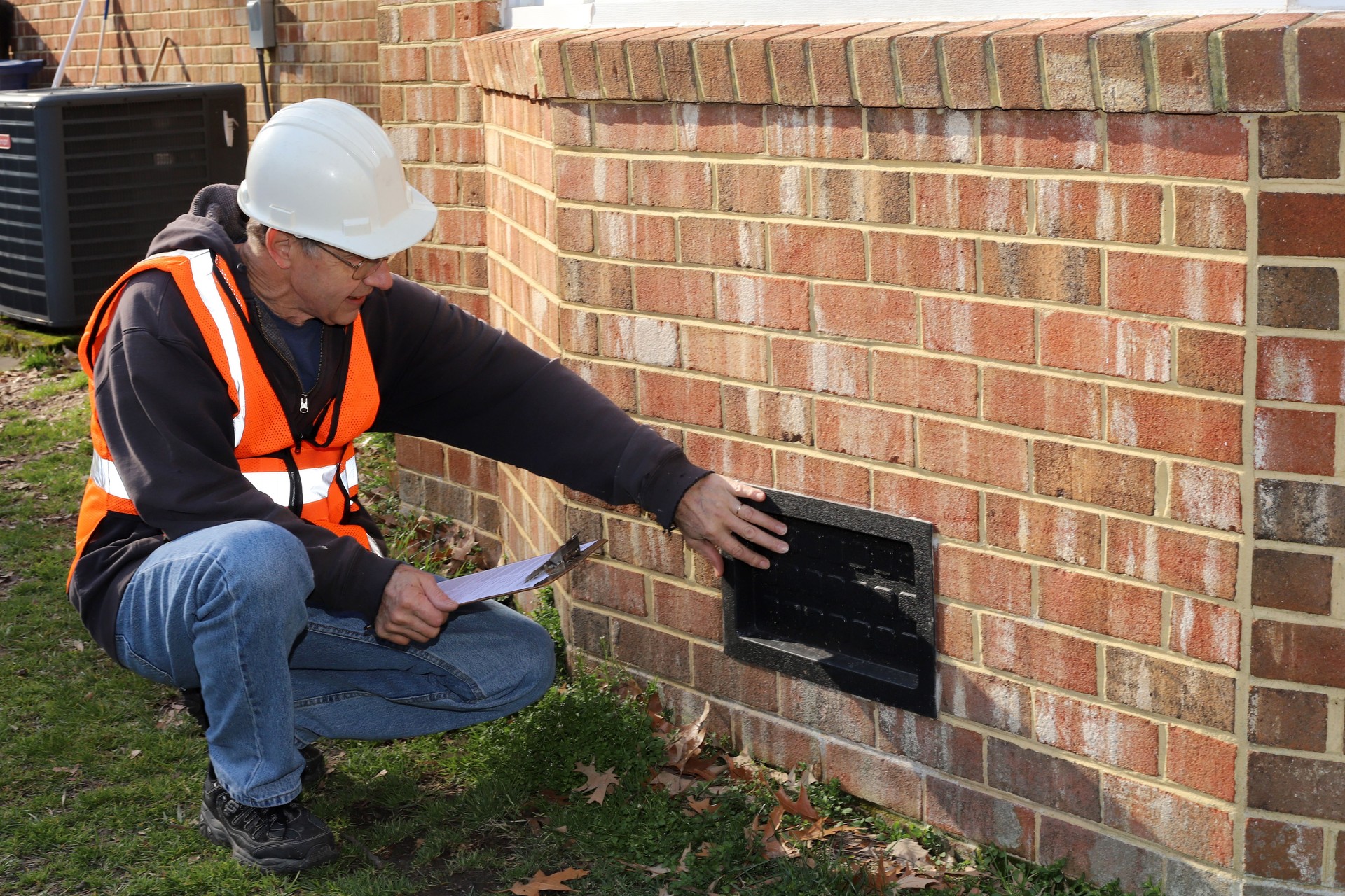 Home inspector checking crawl space